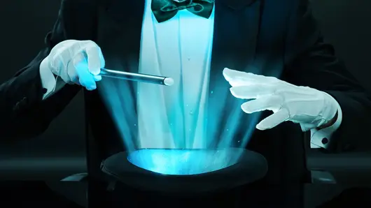 Magician Holding Magic Wand Over Illuminated Hat